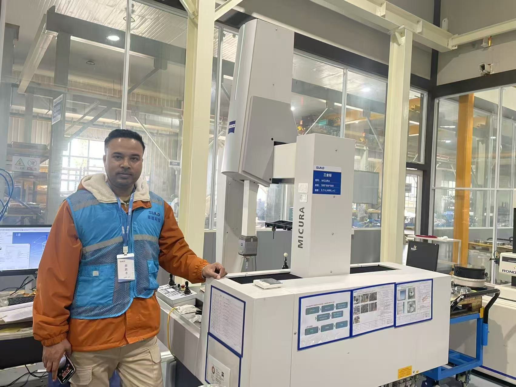 Swiftpath representative beside coordinate measuring equipment during China OEM dimensional inspection
